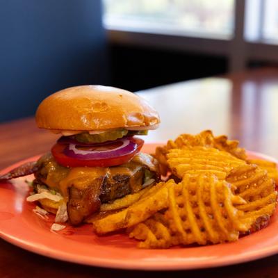 Angus Burger topped with bacon, cheddar cheese and mayo with side of fries.