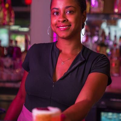 Bartender serving drinks.