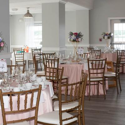 Soft pink dining tables in a bright venue.