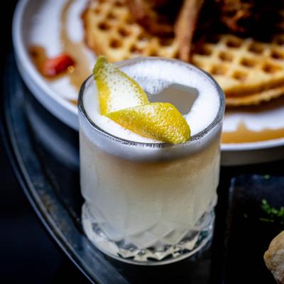 Peaches and Cream cocktail served alongside Chicken and Waffles.