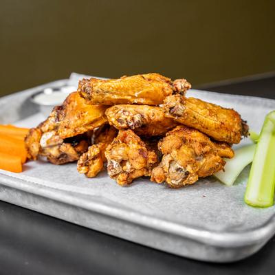 Chicken Wings with carrots and celery sticks.
