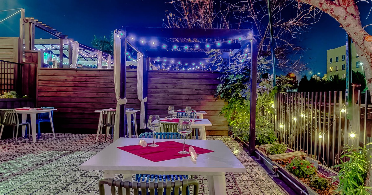 Exterior, tables with glasses and chairs