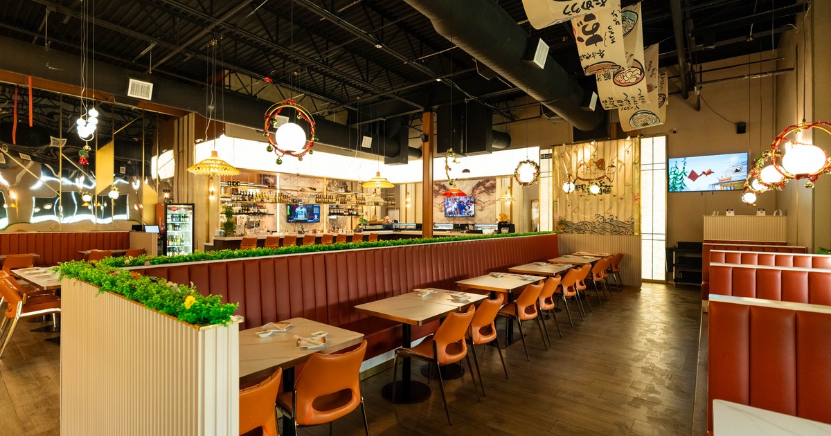 Modern restaurant interior featuring cozy seating, vibrant decor
