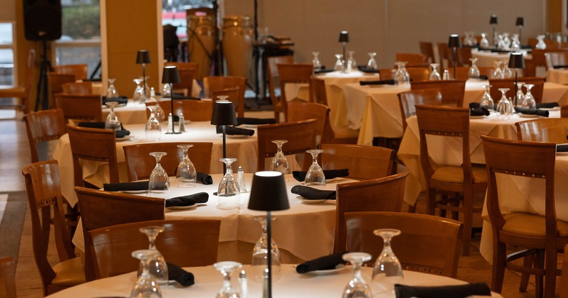 Elegant restaurant interior with round tables set for dining