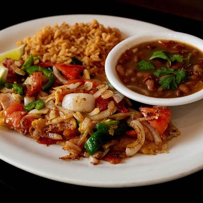 Grilled fish with jalapenos, onion, & tomato, side of rice and drunken beans.