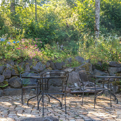 Back garden area with two tables
