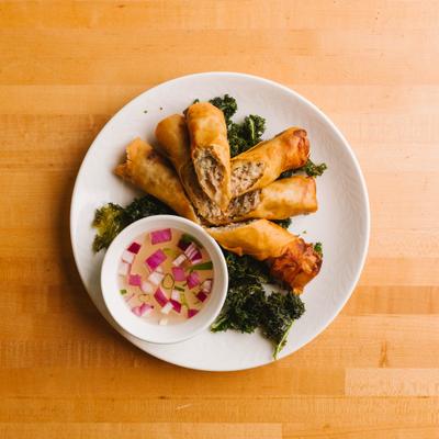 Crispy spring rolls with dipping sauce.