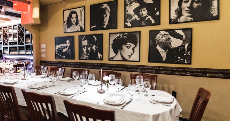 Fully set dining table, vintage photographs on the wall
