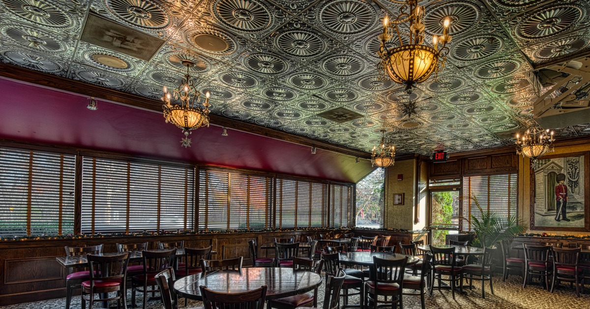 Interior, dining area, wooden top tables and chairs for four and two, windows with blinds