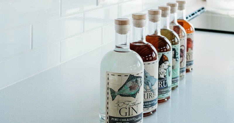 Variety of spirit bottles lined on the counter