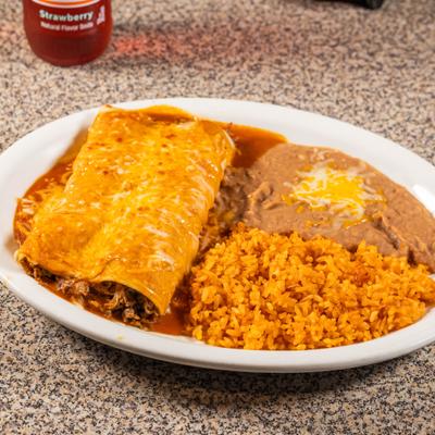 Enchiladas covered in a red sauce and melted cheese, served with rice and beans.