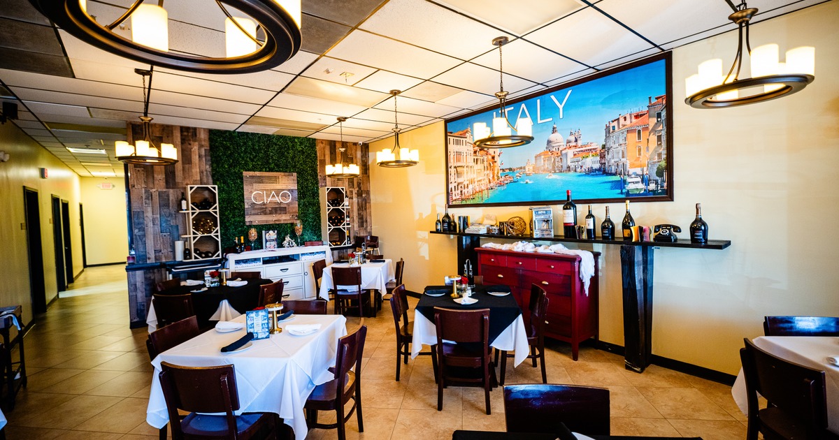 Interior, diner area, diner tables, chairs, screen on the wall