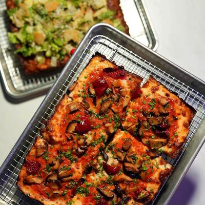 Lil' Caesar pizza  and Play that Funghi Music pizza, top view.