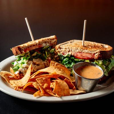 Chicken Salad sandwich, served with tortilla chips and chipotle dressing.