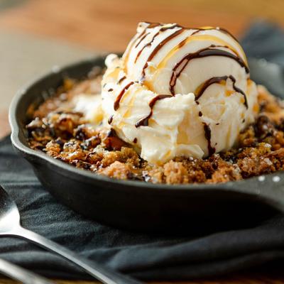 Baked caramel cookie skillet, with vanilla ice cream.