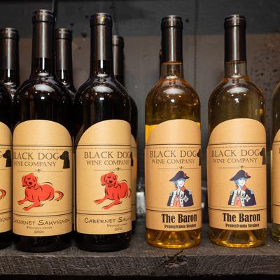 Several bottles on a shelf.