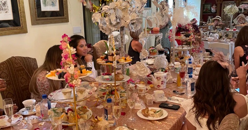 Interior, guests enjoying a celebration at a table