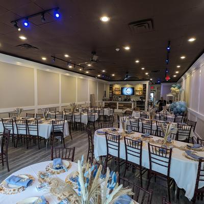 Spacious party room, large dining tables.