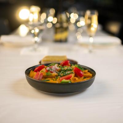 Chicken Masala Alfredo Pasta served on the table.