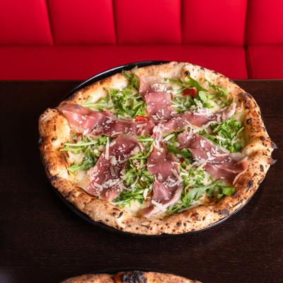 Prosciutto and arugula Pizza.