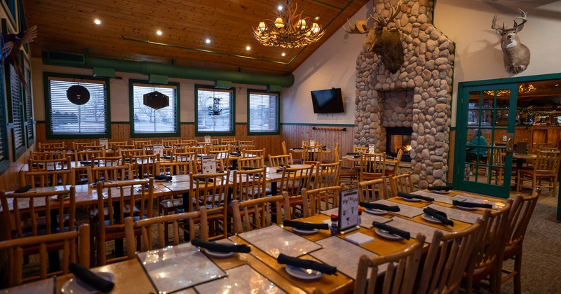 Spacious and cozy interior dining area with set tables, perfect for any special occasion