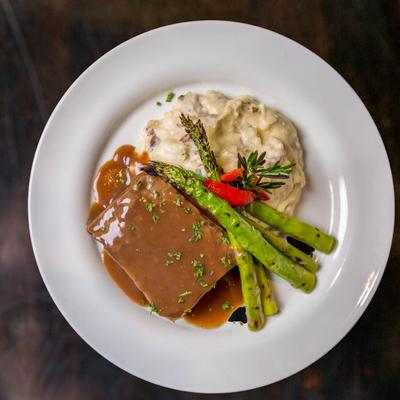 Braised Short Ribs, with red wine reduction sauce, mashed potatoes, and asparagus.