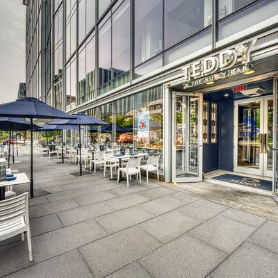 The entrance to the restaurant building and the patio in front.