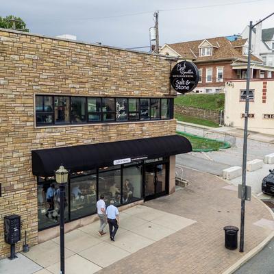 The restaurant's building and the sidewalk.