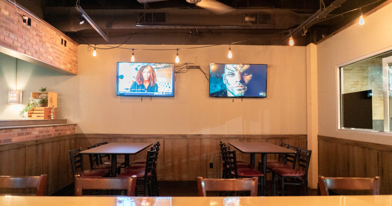 Dining area with TVs in the back