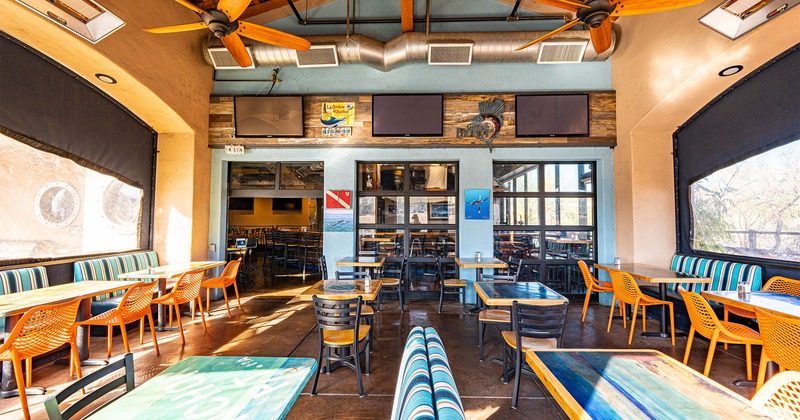 Interior, seating area, TVs on the walls