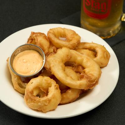 Onion rings with dipping sauce.