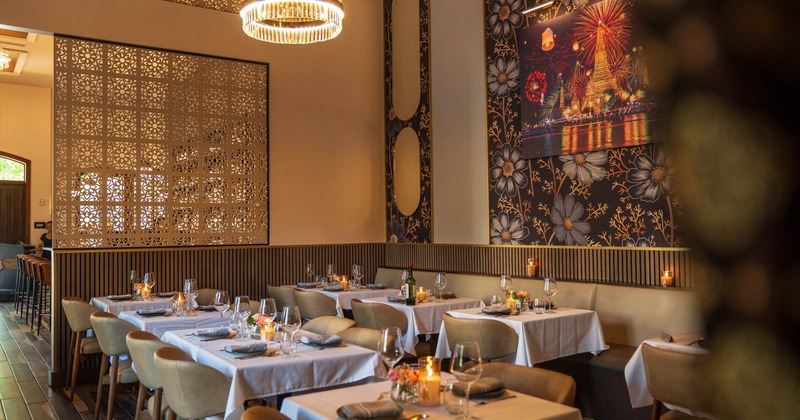 Interior, dining area, banquette bench with tables and chairs, regular tables for four