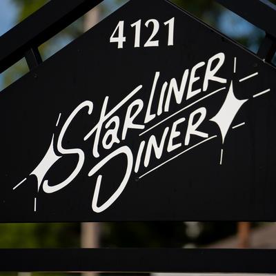 Exterior detail, Starliner Diner gate sign, close up.