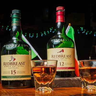 Red Breast Irish Whiskey bottles and shots.