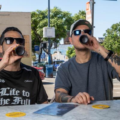 two men drinking beer.