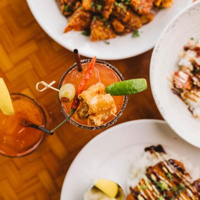 Bloody Mary with appetizers on a restaurant table.