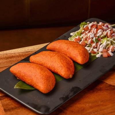 Spicy empanadas and pico de gallo.