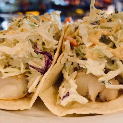 Fish Tacos, with cilantro lime coleslaw, and chipotle aioli.