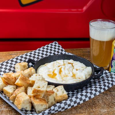 Whipped ricotta and honey dip served with house made focaccia and a glass of beer.