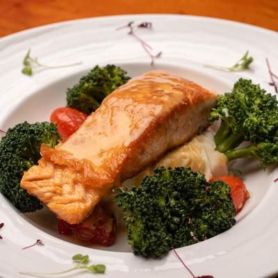 Pan-Seared Salmon served with mashed potatoes and broccoli.