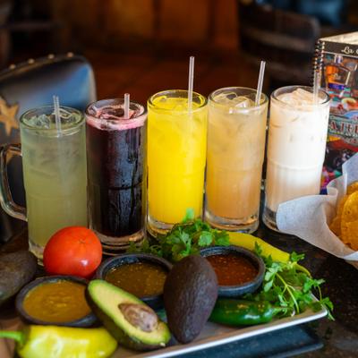 Various drinks and fresh fruit.