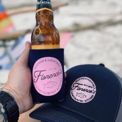 Bottle cosy and baseball cap with company logo.