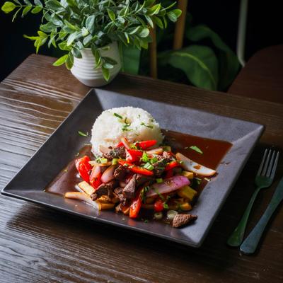 Stir fried steak with veggies and rice.