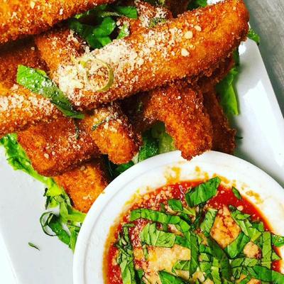 Fried mozzarella sticks with marinara sauce.
