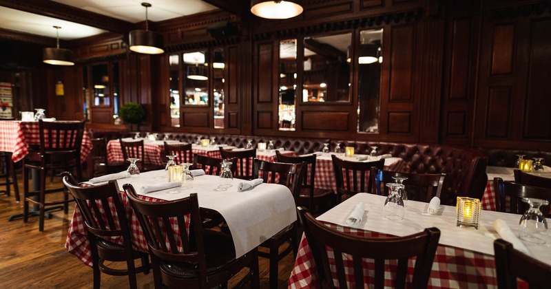 Interior seating area, glasses and candles on the tables