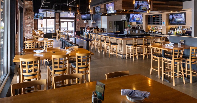 Restaurant interior, dining tables and bar area