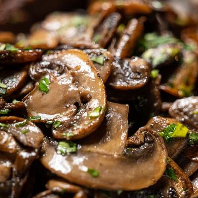 Extreme close up of sauteed mushrooms.