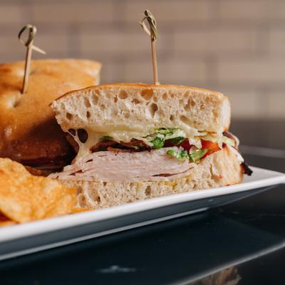 Pisa sandwich with bacon, turkey, lettuce, tomatoes, and mayo.