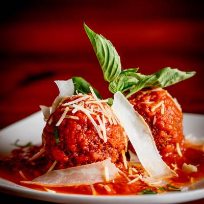 Deep fried rice balls stuffed with fresh mozzarella and spinach, served with marinara.