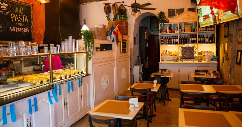 Interior, dining area and bar area in the back